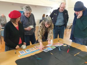 Participants engaging in interactive tabletop activities at the Community Visioning Workshop at Sanquhar.