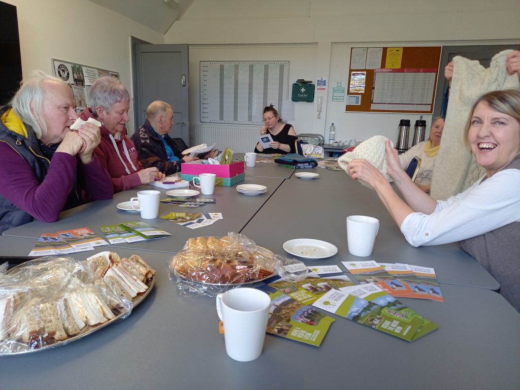 Wool Gatherers looking at knitted and crocheted items at the Barrhill Bleat n' Blether event.