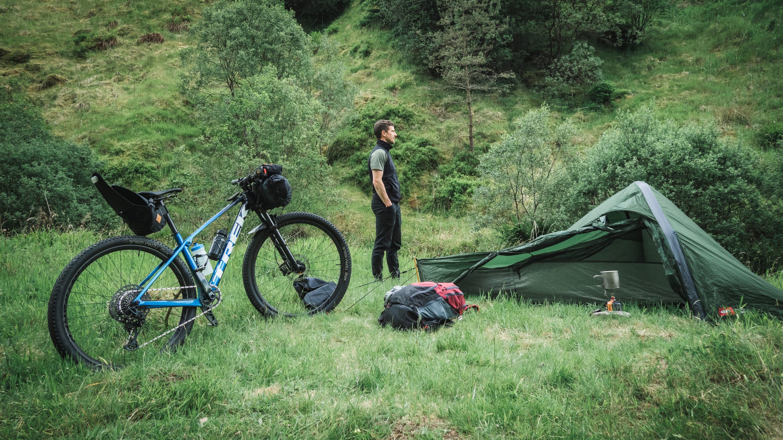Paul Osborne, Director of The Biking Explorers, with his bike and tent.